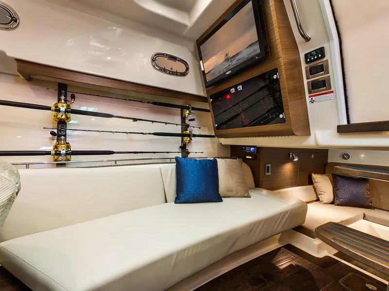 Slide: The Image of Luxurious interior of 2017 Boston Whaler 345 Conquest with fishing rods and cozy seating. - 25