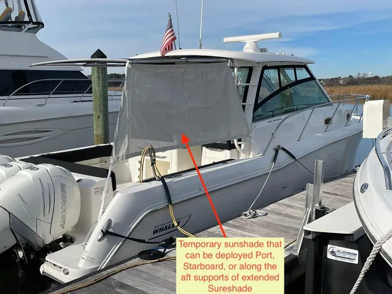 Slide: The Image of 2017 Boston Whaler 345 Conquest with temporary sunshade at dock. - 4