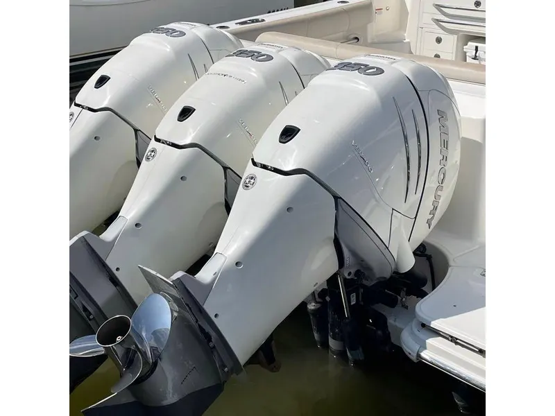 Slide: The Image of Triple Mercury outboard engines on 2017 Boston Whaler 345 Conquest boat. - 8