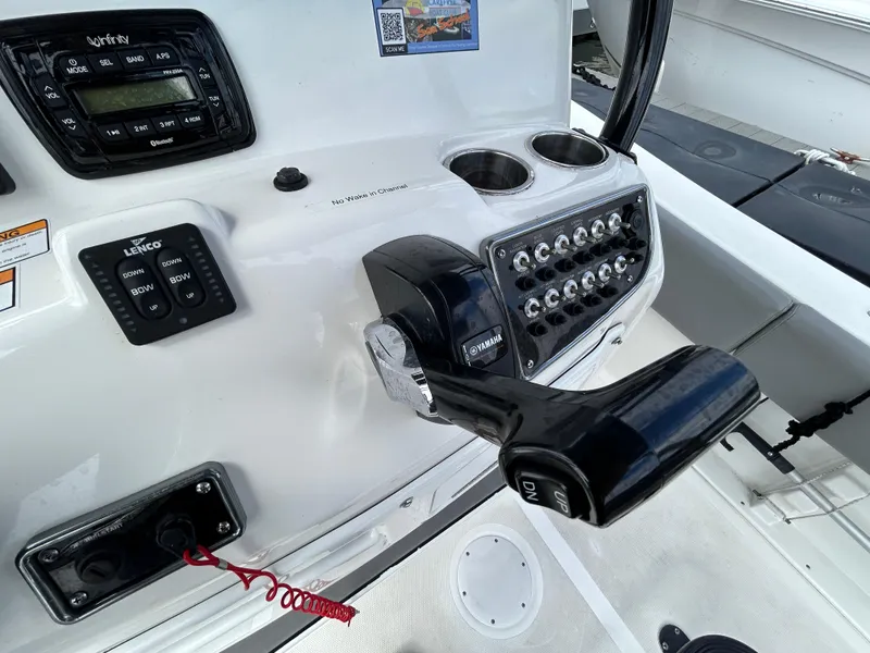 Slide: The Image of Close-up of 2021 NauticStar 2302 Legacy boat control panel and throttle. - 11