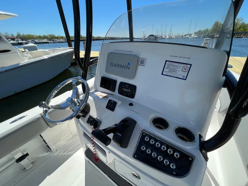 Slide: The Image of 2021 NauticStar 2302 Legacy boat console with Garmin navigation system. - 22