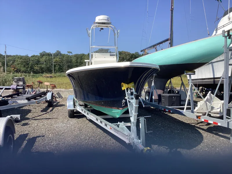 Slide: The Image of 2007 Jones Brothers 23 Cape Fisherman boat on trailer in outdoor setting. - 10