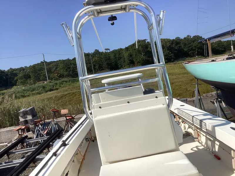 Slide: The Image of 2007 Jones Brothers 23 Cape Fisherman boat with center console, parked outdoors. - 12