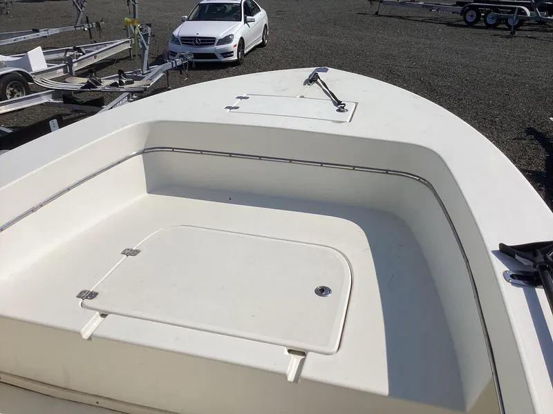 Slide: The Image of 2007 Jones Brothers 23 Cape Fisherman boat deck with storage compartments. - 14