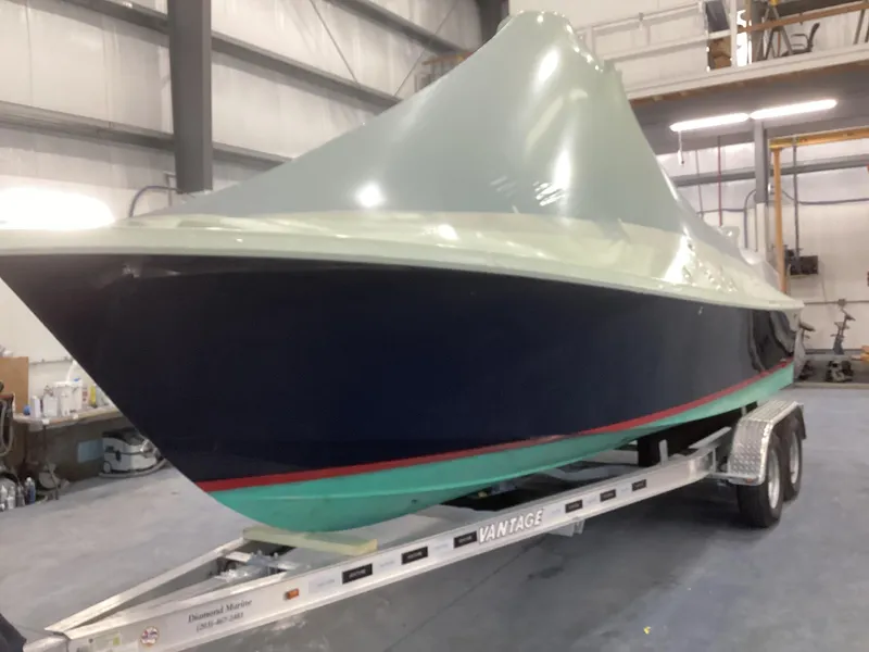 Slide: The Image of 2007 Jones Brothers 23 Cape Fisherman boat on trailer in a warehouse. - 16