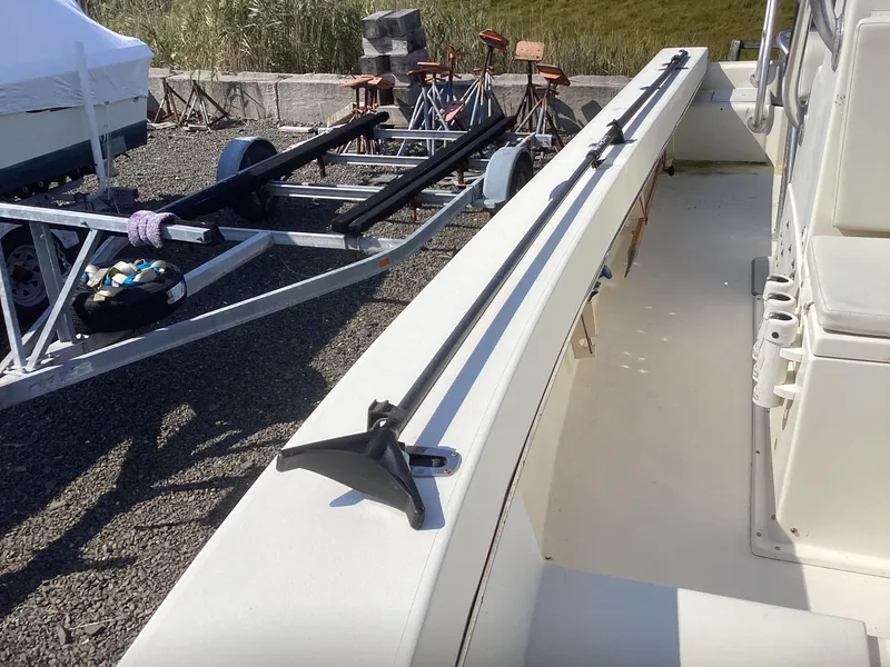 Slide: The Image of 2007 Jones Brothers 23 Cape Fisherman boat interior with trailer in background. - 3