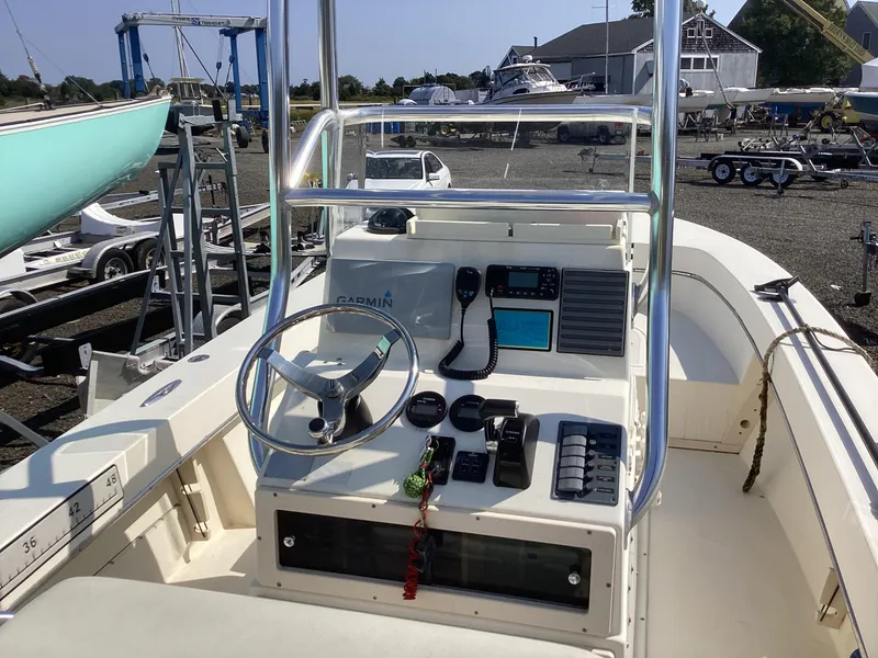 Slide: The Image of 2007 Jones Brothers 23 Cape Fisherman boat console with steering wheel and navigation equipment. - 8