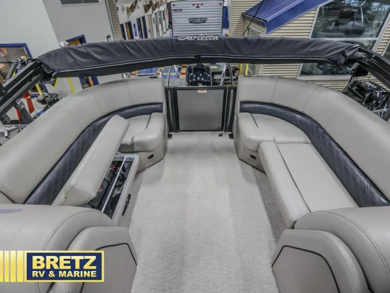 Slide: The Image of 2019 E-Class E22QC boat interior with plush seating at Bretz RV & Marine showroom. - 10