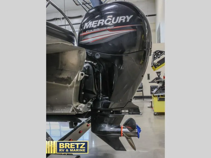 Slide: The Image of Mercury FourStroke outboard motor on a 2019 E-Class E22QC boat at Bretz RV & Marine. - 5