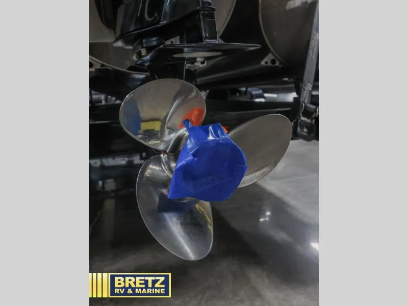 Slide: The Image of Close-up of a 2019 E-Class E22QC boat propeller with blue tape, Bretz RV & Marine logo. - 6