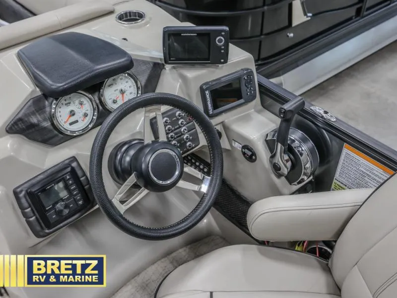Slide: The Image of Dashboard of 2019 E-Class E22QC boat with steering wheel and controls. - 8