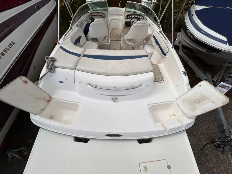 Slide: The Image of 2002 Chaparral 220 SSi boat interior with seating and storage compartments. - 15
