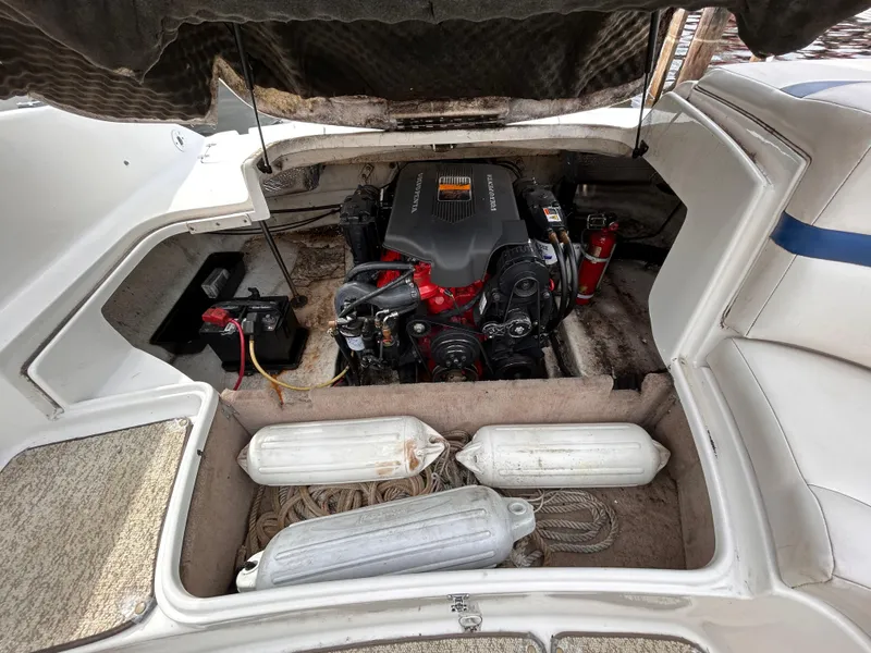 Slide: The Image of Open engine compartment of 2002 Chaparral 220 SSi boat with visible engine and accessories. - 26