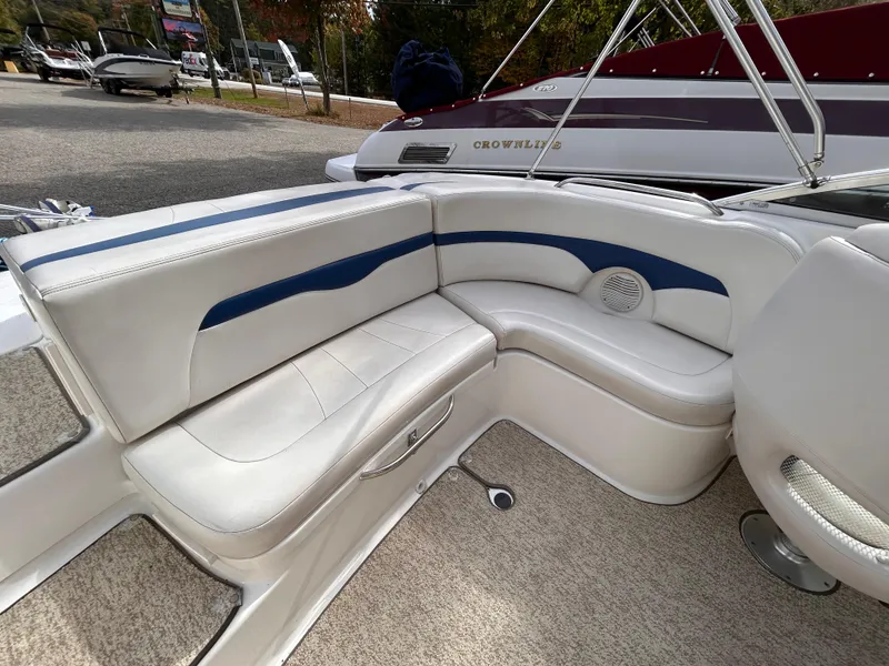 Slide: The Image of 2002 Chaparral 220 SSi boat interior with white and blue seating. - 27
