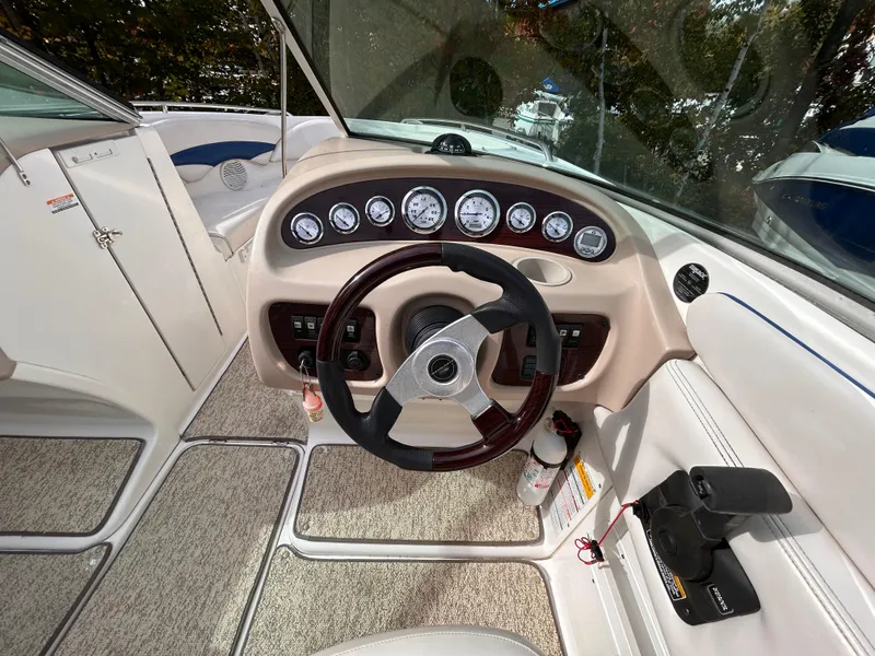 Slide: The Image of 2002 Chaparral 220 SSi boat dashboard with steering wheel and gauges. - 33
