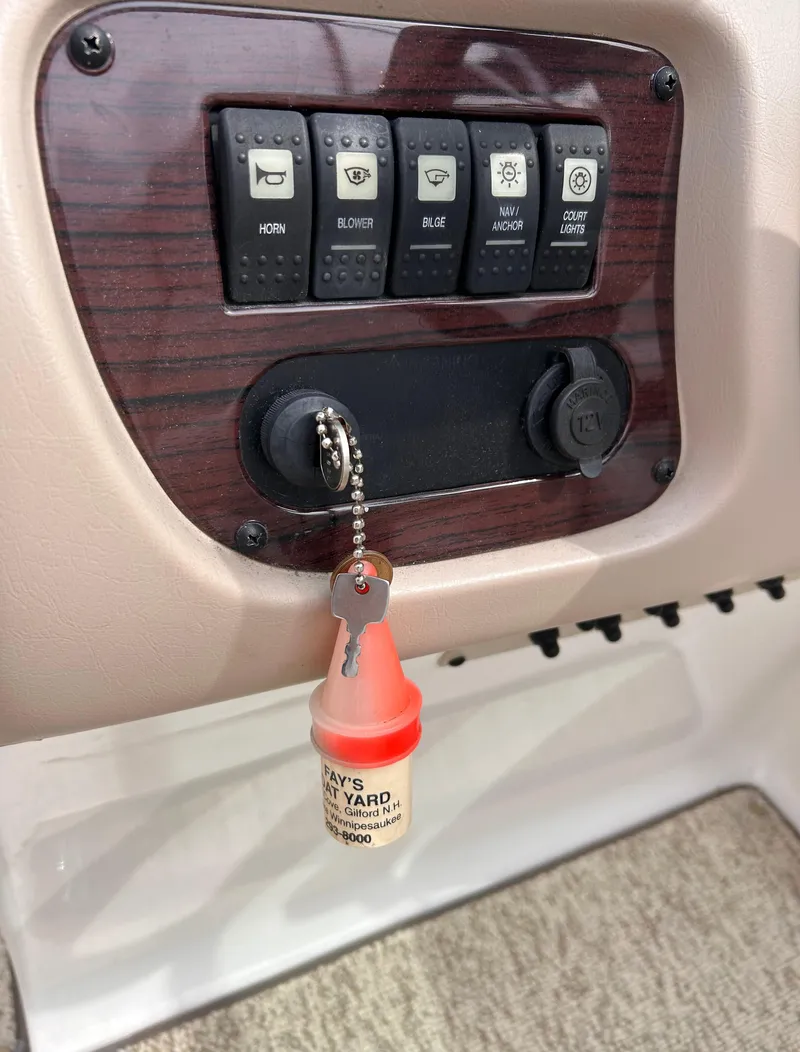 Slide: The Image of Control panel of a 2002 Chaparral 220 SSi boat with key ignition. - 34