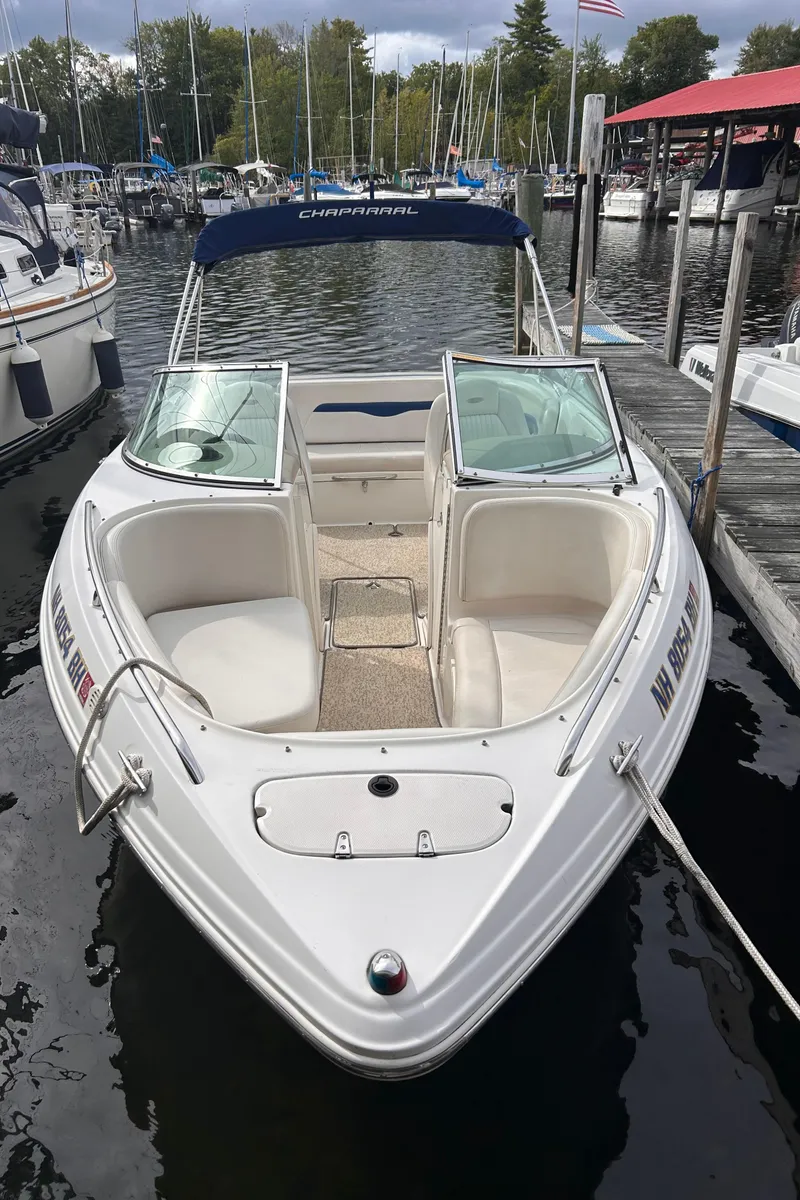Slide: The Image of 2002 Chaparral 220 SSi boat docked at marina, front view. - 4