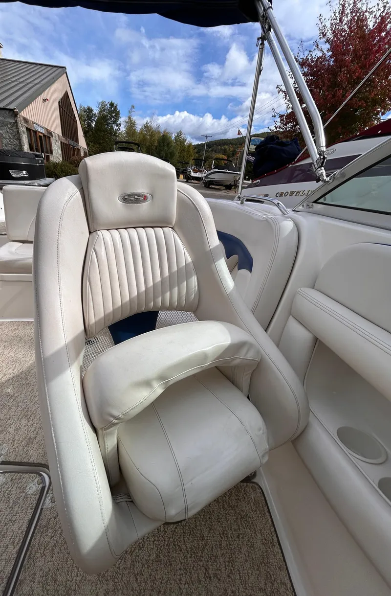 Slide: The Image of 2002 Chaparral 220 SSi boat interior with white leather seating and modern design. - 44