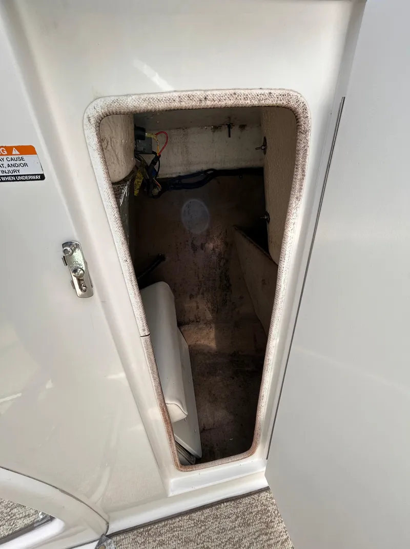 Slide: The Image of Interior storage compartment of 2002 Chaparral 220 SSi boat. - 48