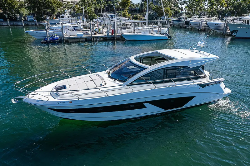 Slide: The Image of 2022 Beneteau Gran Turismo 45 yacht cruising in a marina. - 1