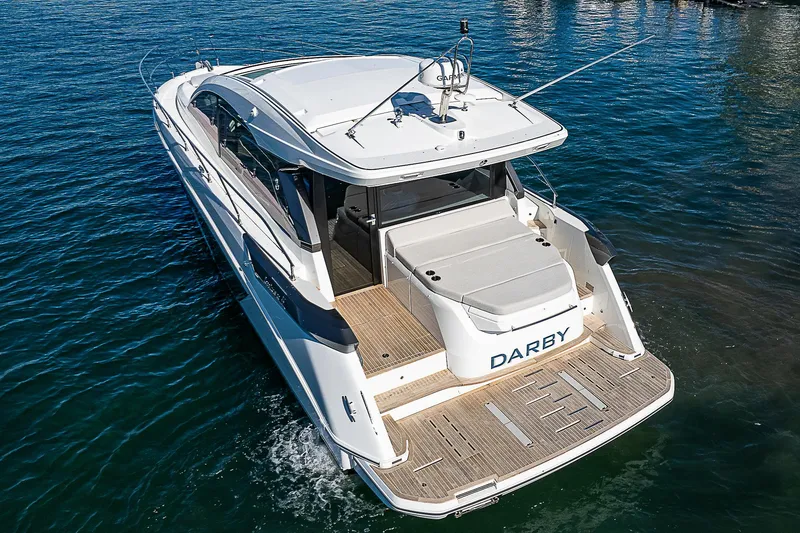 Slide: The Image of 2022 Beneteau Gran Turismo 45 yacht cruising on open water. - 12