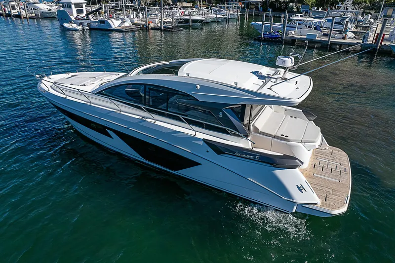 Slide: The Image of 2022 Beneteau Gran Turismo 45 yacht docked in a marina. - 14