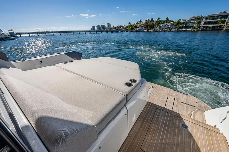 Slide: The Image of Beneteau Gran Turismo 45 yacht, 2022 model, cruising on a sunny waterfront. - 16