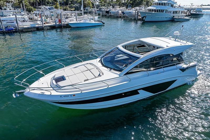 Slide: The Image of 2022 Beneteau Gran Turismo 45 yacht on a sunny marina. - 2