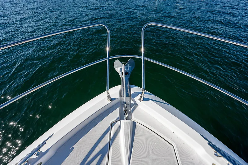 Slide: The Image of Bow view of 2022 Beneteau Gran Turismo 45 yacht on open water. - 24