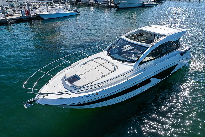 Slide: The Image of 2022 Beneteau Gran Turismo 45 yacht on water, sleek design, sunny day. - 3