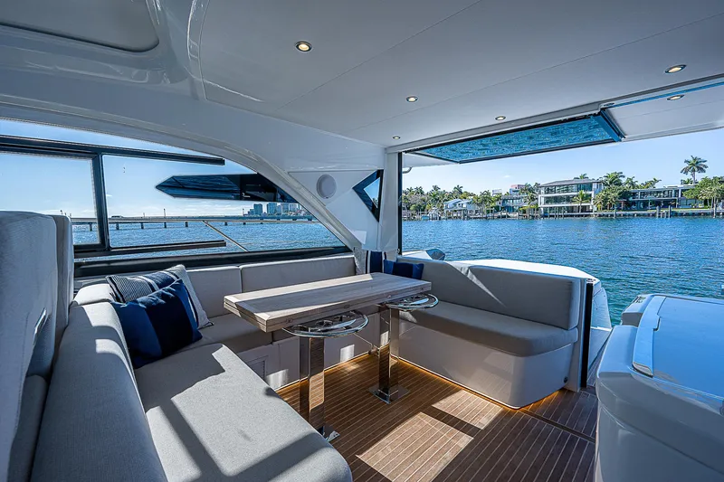 Slide: The Image of Interior of 2022 Beneteau Gran Turismo 45 yacht with waterfront view. - 35