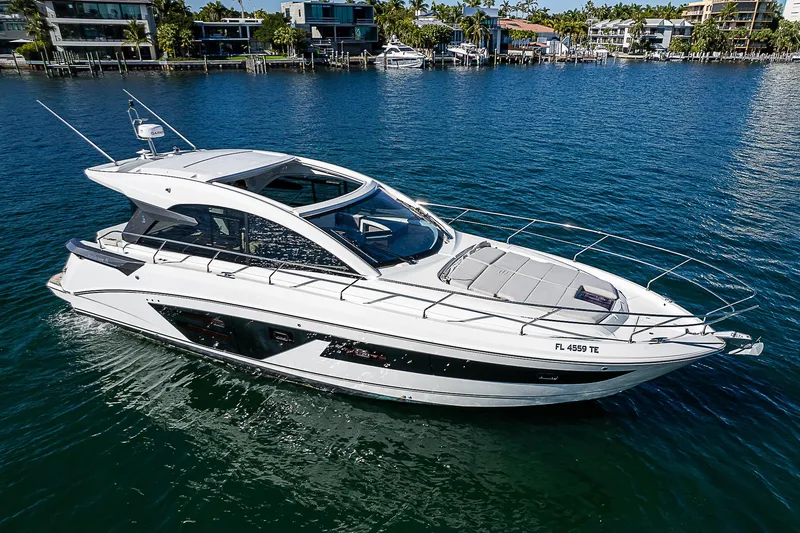 Slide: The Image of 2022 Beneteau Gran Turismo 45 yacht on serene water, modern design, luxury boating. - 6