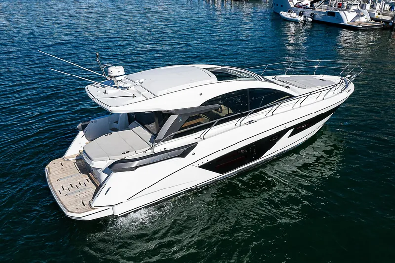 Slide: The Image of 2022 Beneteau Gran Turismo 45 yacht cruising on open water. - 8