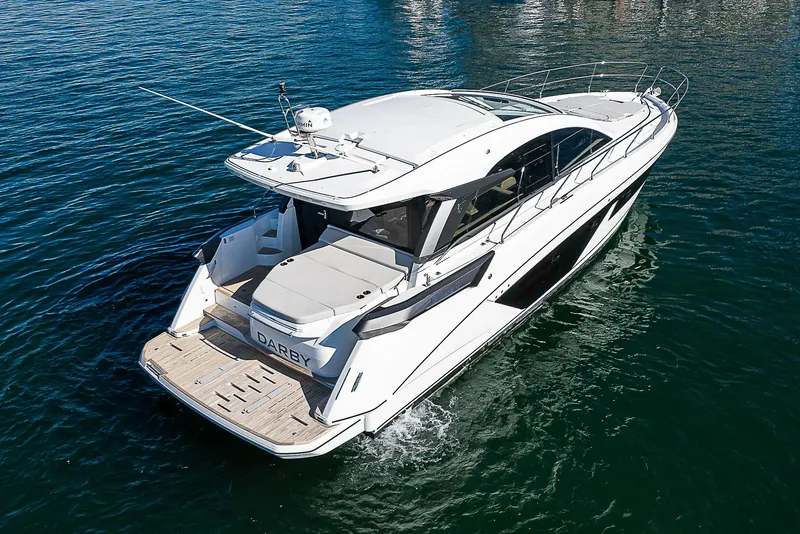 Slide: The Image of 2022 Beneteau Gran Turismo 45 yacht cruising on open water. - 9