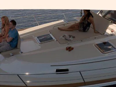 Slide: The Image of 2025 Sabre 51 Salon Express yacht with people relaxing on deck. - 12