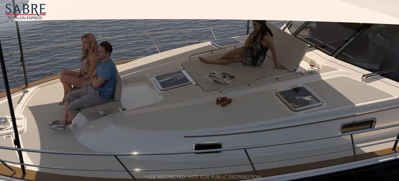 Slide: The Image of 2025 Sabre 51 Salon Express yacht with people relaxing on deck. - 5