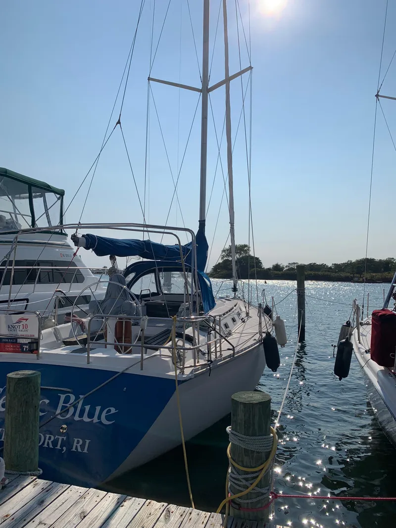Slide: The Image of 1985 Hunter Legend 40 sailboat docked in sunny marina. - 28