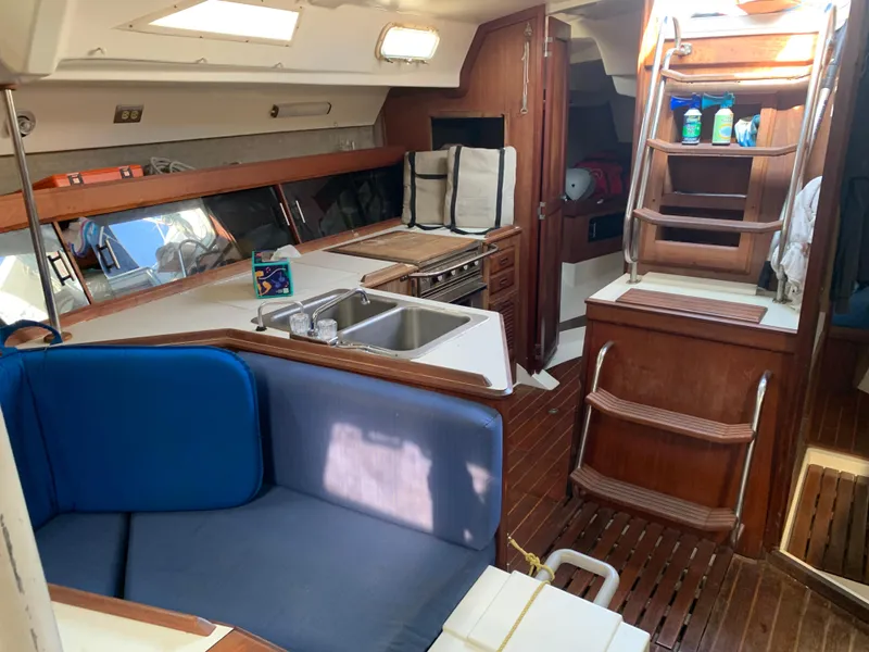 Slide: The Image of Interior of 1985 Hunter Legend 40 sailboat with kitchen and seating area. - 5