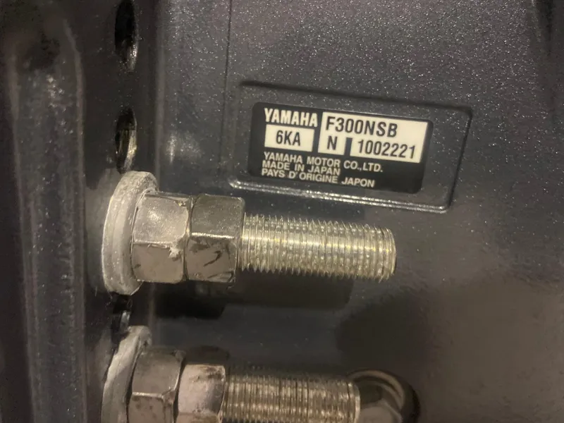 Slide: The Image of Close-up of Yamaha F300NSB engine label on 2022 Cobia 240 Dual Console boat. - 31