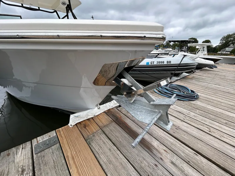 Slide: The Image of 2022 Cobia 240 Dual Console boat anchored at a wooden dock. - 7