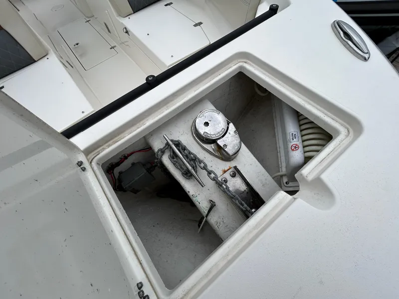 Slide: The Image of Cobia 240 Dual Console 2022 boat storage compartment with equipment. - 8