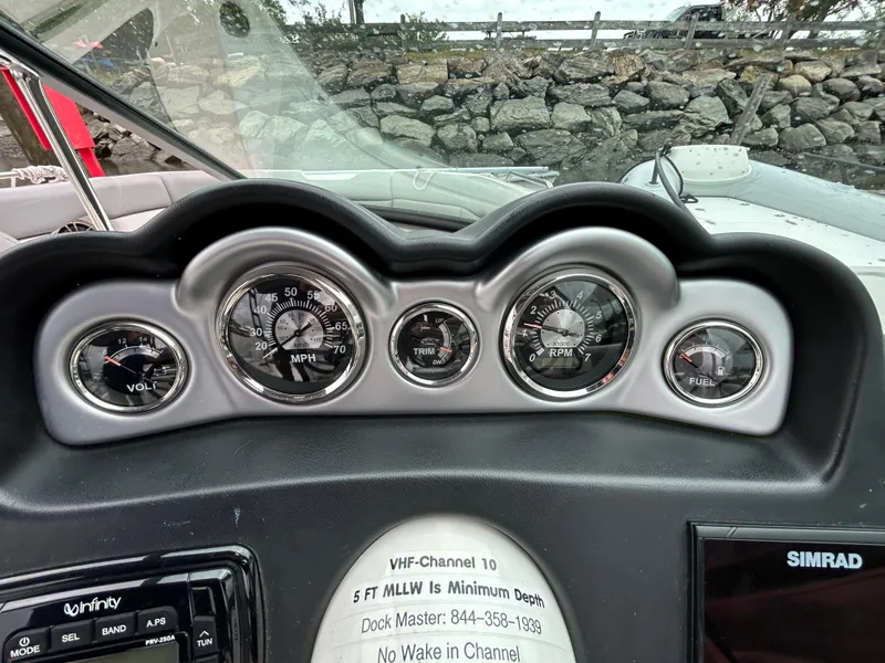 Slide: The Image of Dashboard of 2021 NauticStar 243 DC boat with gauges and controls. - 16