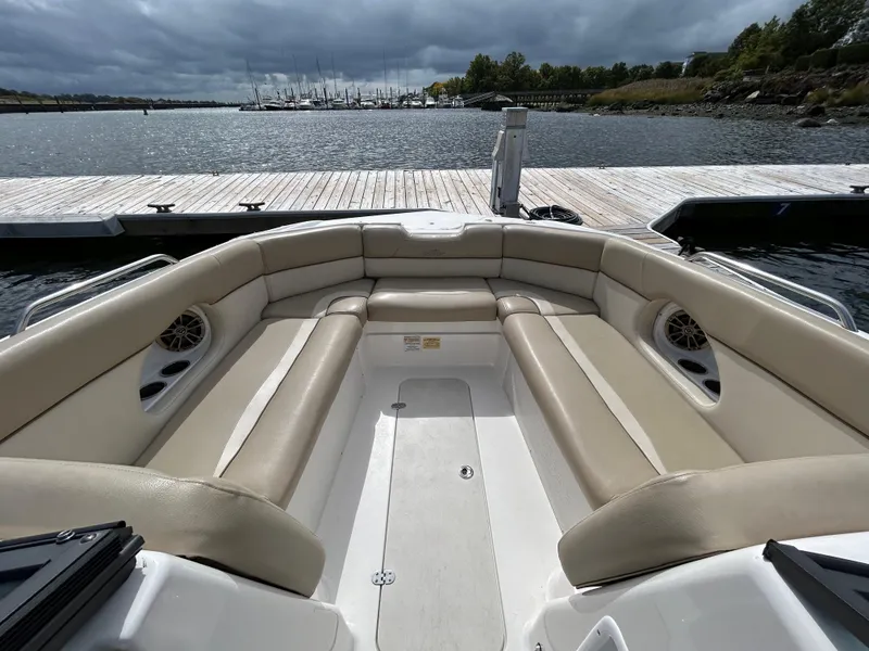 Slide: The Image of 2022 NauticStar 243 DC boat with beige seating at a dock. - 17