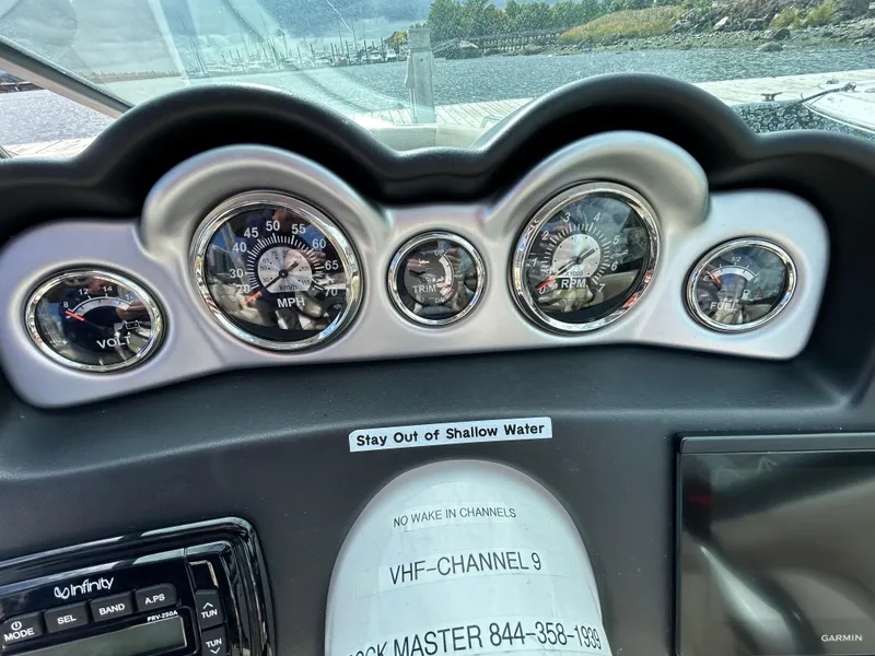 Slide: The Image of Dashboard of 2022 NauticStar 243 DC boat with gauges and navigation equipment. - 9