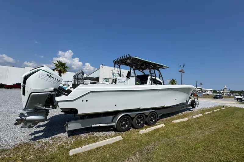 Slide: The Image of 2022 Nor-Tech 392 Super Fish boat on trailer, parked outdoors under clear blue sky. - 10