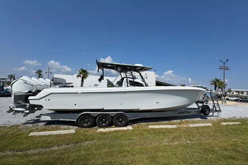 Slide: The Image of 2022 Nor-Tech 392 Super Fish boat on trailer under clear blue sky. - 11