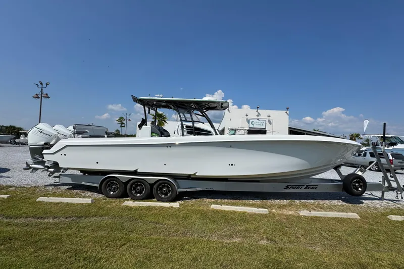 Slide: The Image of 2022 Nor-Tech 392 Super Fish boat on trailer, parked outdoors under clear sky. - 12