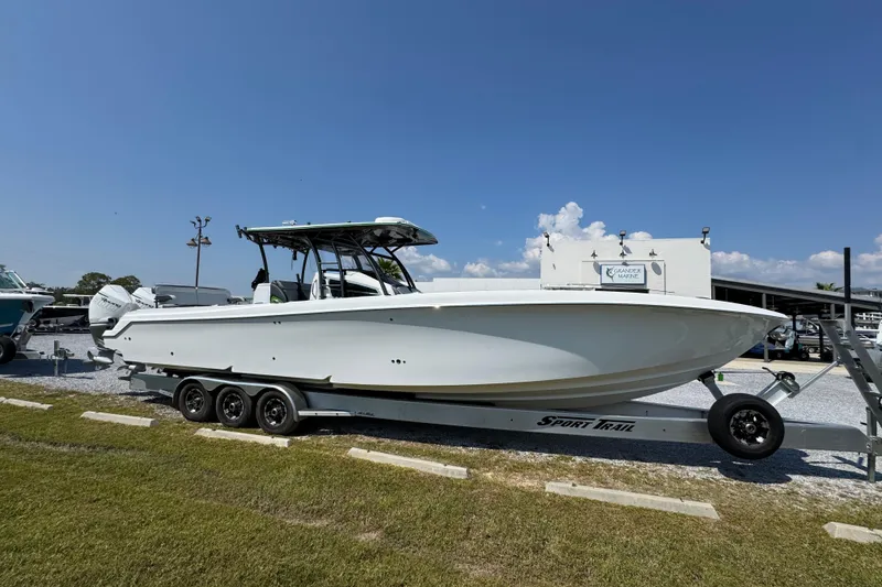 Slide: The Image of 2022 Nor-Tech 392 Super Fish boat on trailer under clear blue sky. - 13