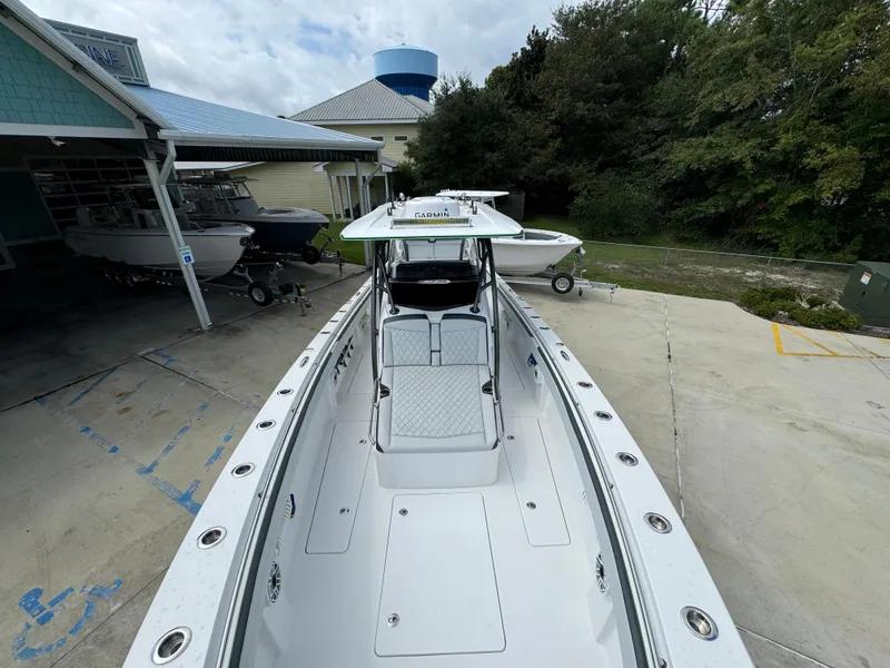 Slide: The Image of 2022 Nor-Tech 392 Super Fish boat docked at a marina. - 22