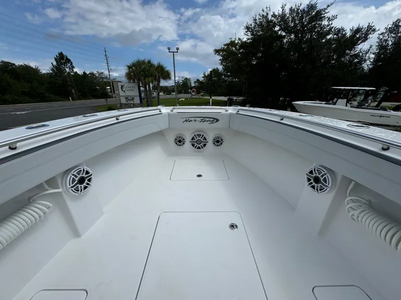 Slide: The Image of 2022 Nor-Tech 392 Super Fish boat interior with speakers and storage compartments. - 24